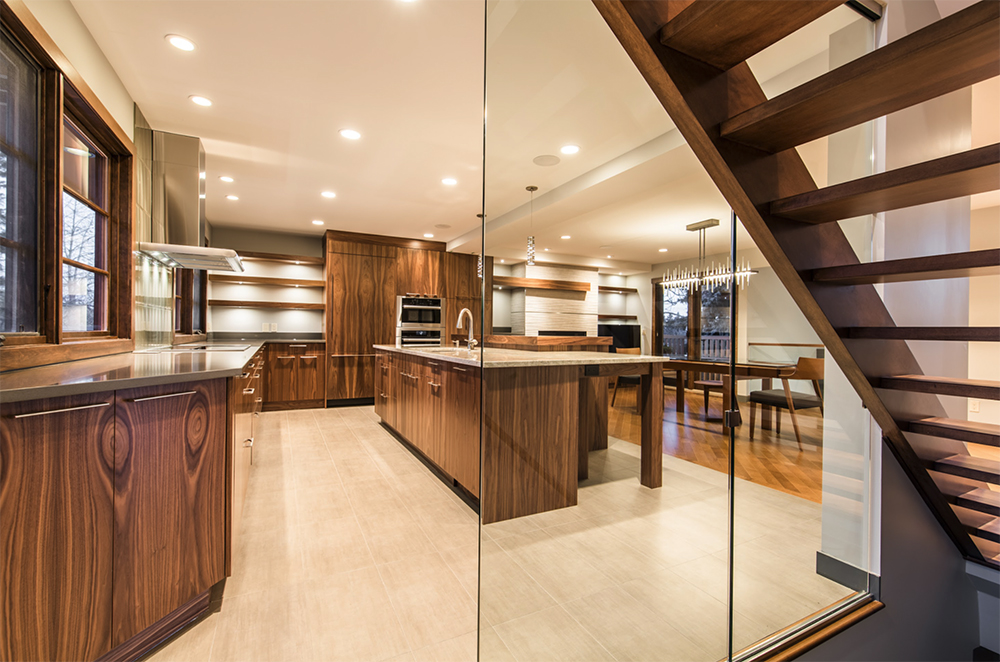 Aging-in-place kitchen design in a Calgary home with multi-height counters and accessible storage